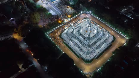 aerial time-lapse view over big pagoda in asokaram temple in samutprakarn near bangkok thailand during asalha puja(asanha bucha)buddhist festival which typically takes place in july, on the full moon.