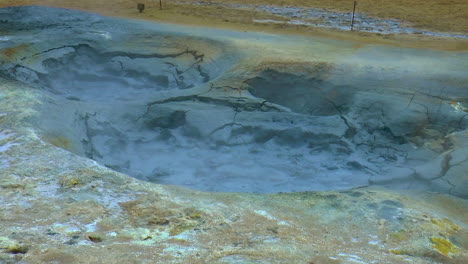 Slow-motion-footage-of-hot-springs,-steaming-fumaroles-and-boiling-mud-pots-in-Hverir---Namafjall-Geothermal-Area-in-Iceland