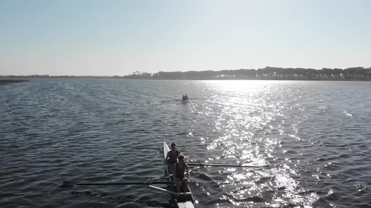 Female rowers training on a river