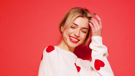 happy woman in white heart sweater