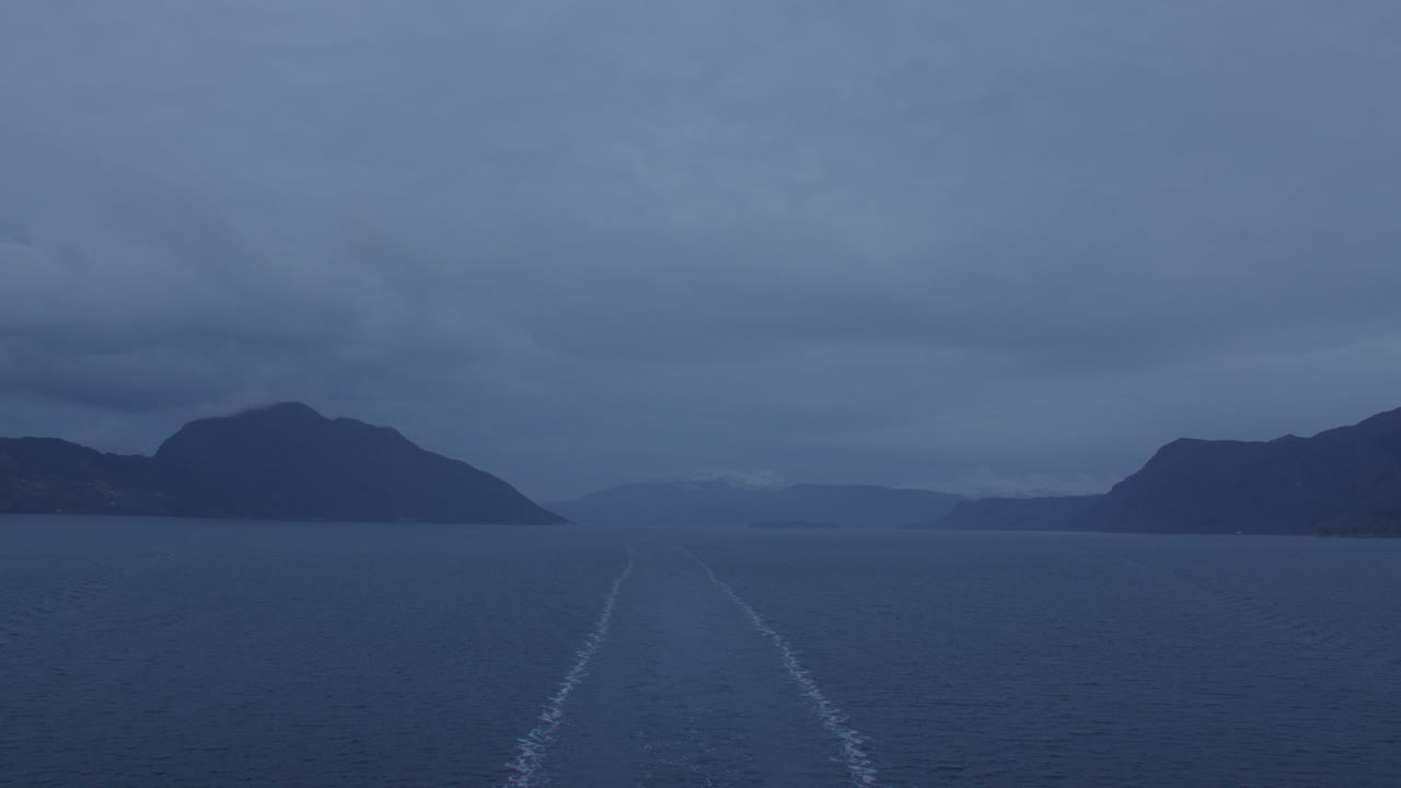 shot of the back of the ship transiting Hardanger, Hardangerfjorden in Early morning