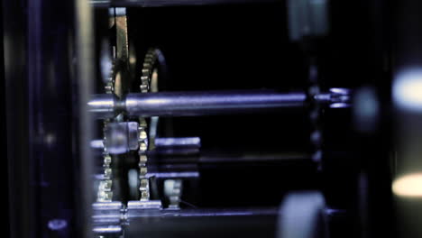 close up macro of an old clock mechanism clockwork gear with a turning movement