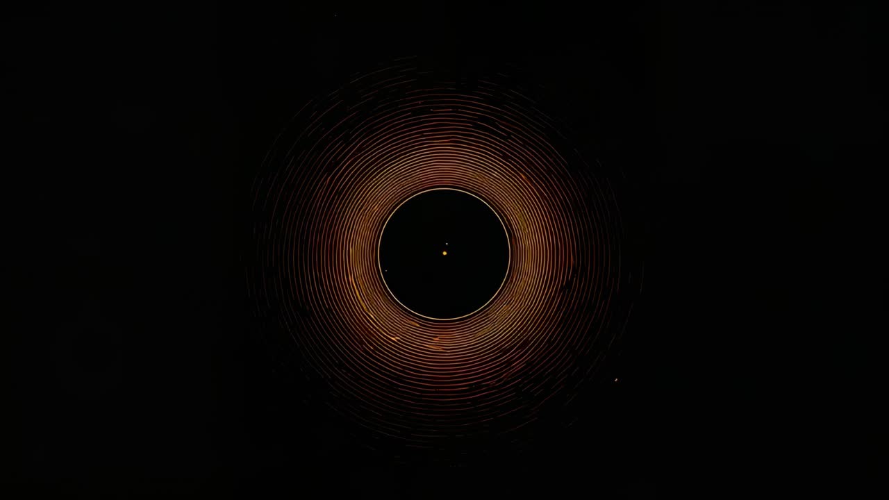 Brightening annular core forming inner ring while expanding ridges inside dark void, revealing dot