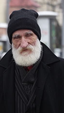 portrait of an elderly man in winter