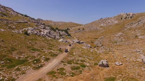 Off-road-cars-driving-on-mountain-and-rocks