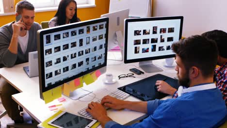 Graphic-designers-working-at-their-desk