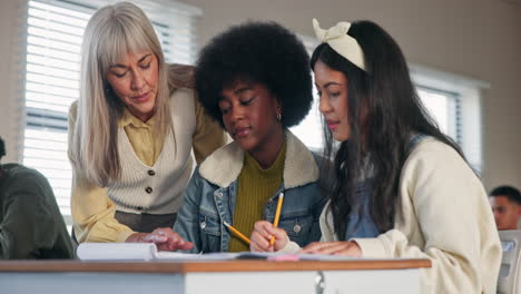 teacher helping students in classroom