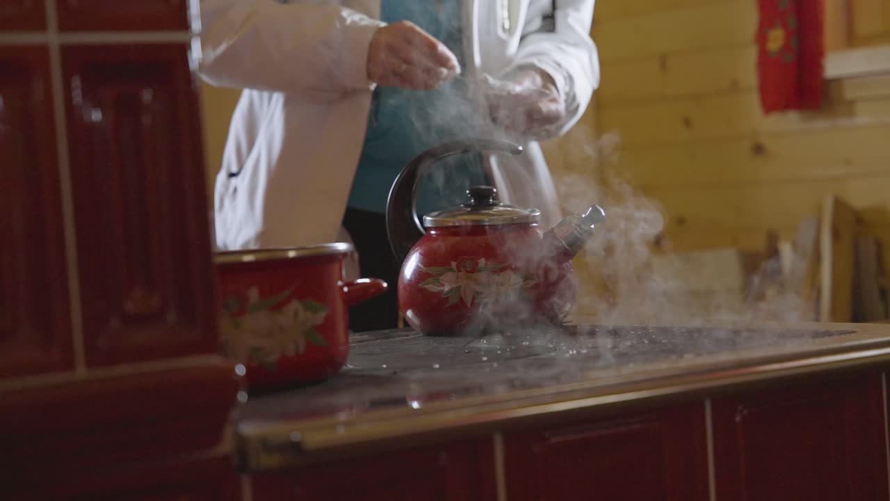 snow dropping on a hot stove malting and moving around captured in slow motion in 4k