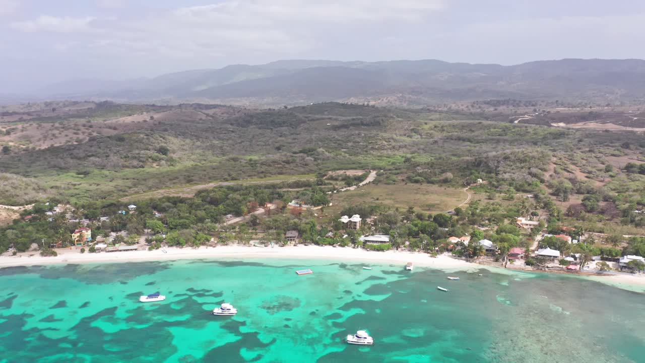 Yachts Floating In The Crystal-clear Blue Water Of Playa La Ensenada In Dominican Republic