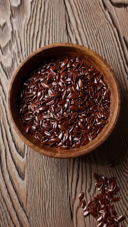 flax seeds in wooden bowl