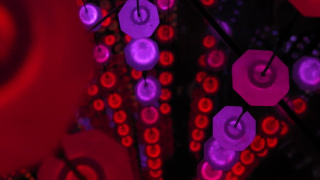 abstract art installation with hanging red and pink octagons