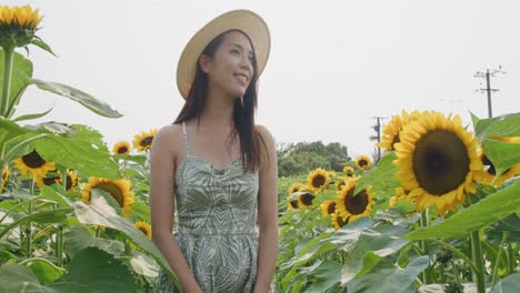 Lower-view-of-an-asian-woman-in-hat