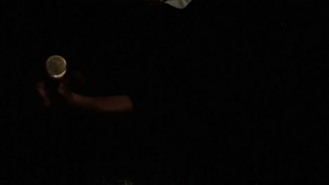 someone hitting baseball with bat on black background