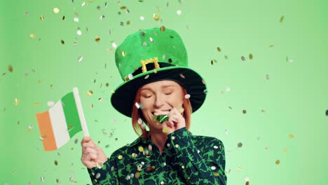 woman blowing party horn blower under shower of confetti