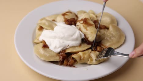 pierogi with sour cream and onions