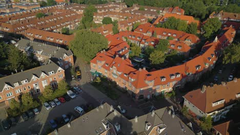 orbit above beautiful and unique orange roofs of dutch working class houses