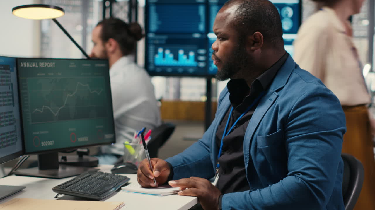 Vertical Video Black employee building new development strategy with notes