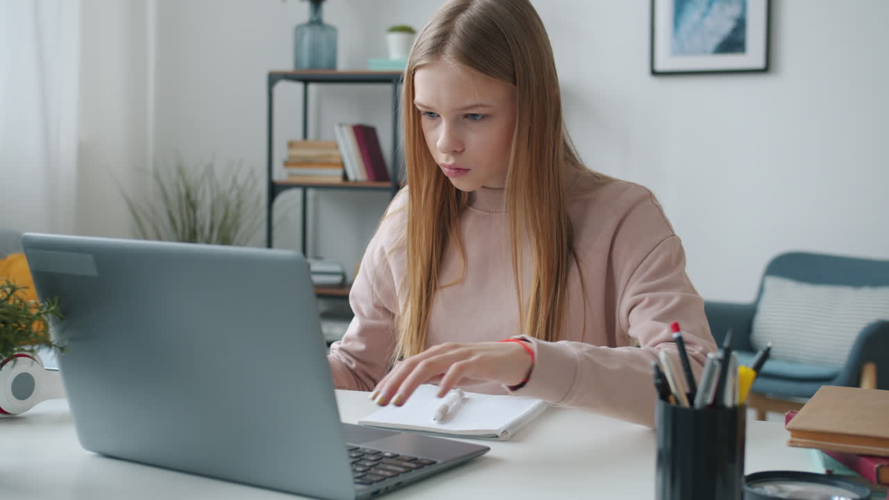 Teenage Girl Studying Online and Doing Homework