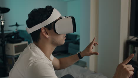 man uses vr headset and gestures at digital interface at home in amaze