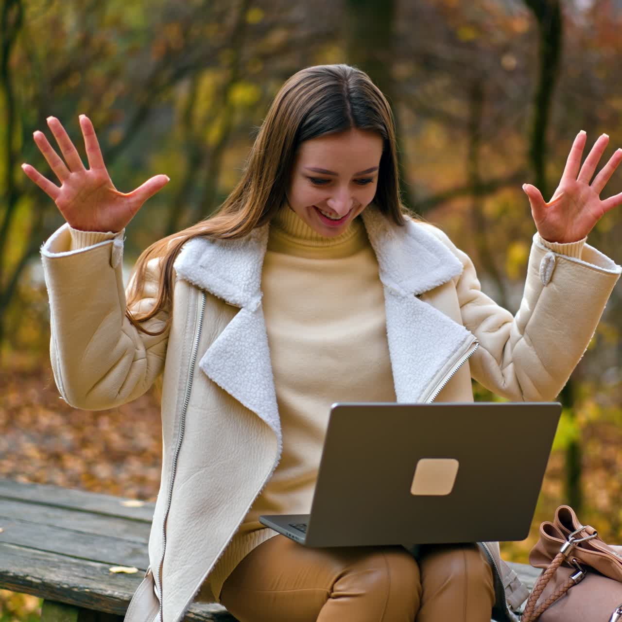 Beautiful lady online studying outdoor in park. Young lady working with laptop