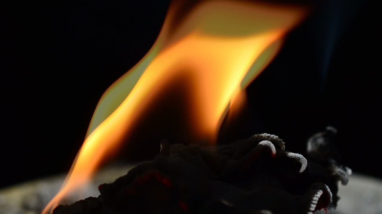 Slow Motion. Fabric burns. Slow Motion. Shooting of the burning fabric