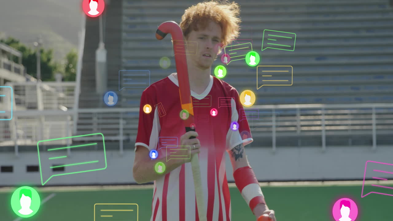 Holding stick, field hockey player with animation of social media icons around