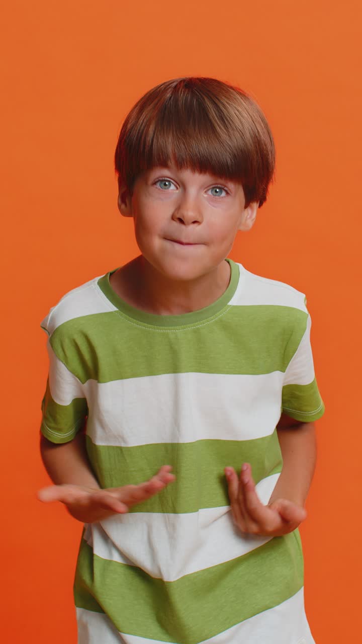 Confused puzzled preteen child boy kid pointing fingers himself not guilty not my fail innocently