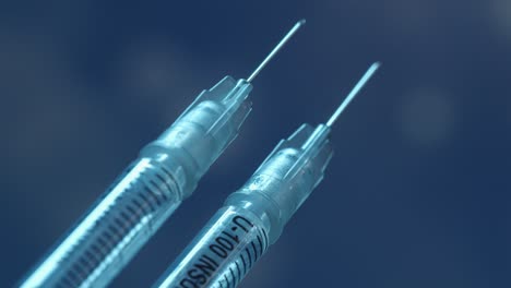 vista macro de dos jeringas para ambas dosis de la vacuna contra el coronavirus, aisladas con fondo de partículas