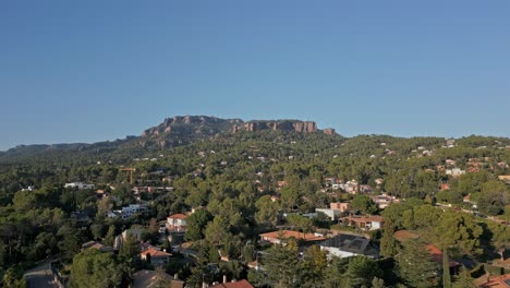 Drone-Flight-Over-Matadepera,-Valles-Occidental,-Barcelona,-Catalonia,-Spain,-With-Sant-Llorenc-Del-Munt-In-The-Background