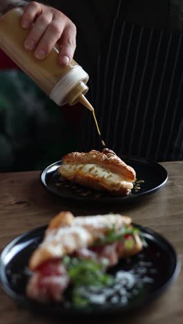 chef preparing croissant sandwiches