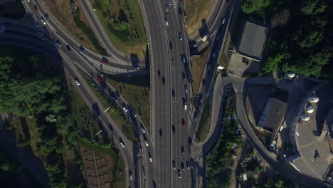 Drone-view-car-driving-on-freeway-overpass..-Car-traffic-on-highway-intersection