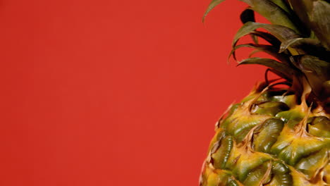 A-ripe-whole-ananas-on-a-rotating-surface