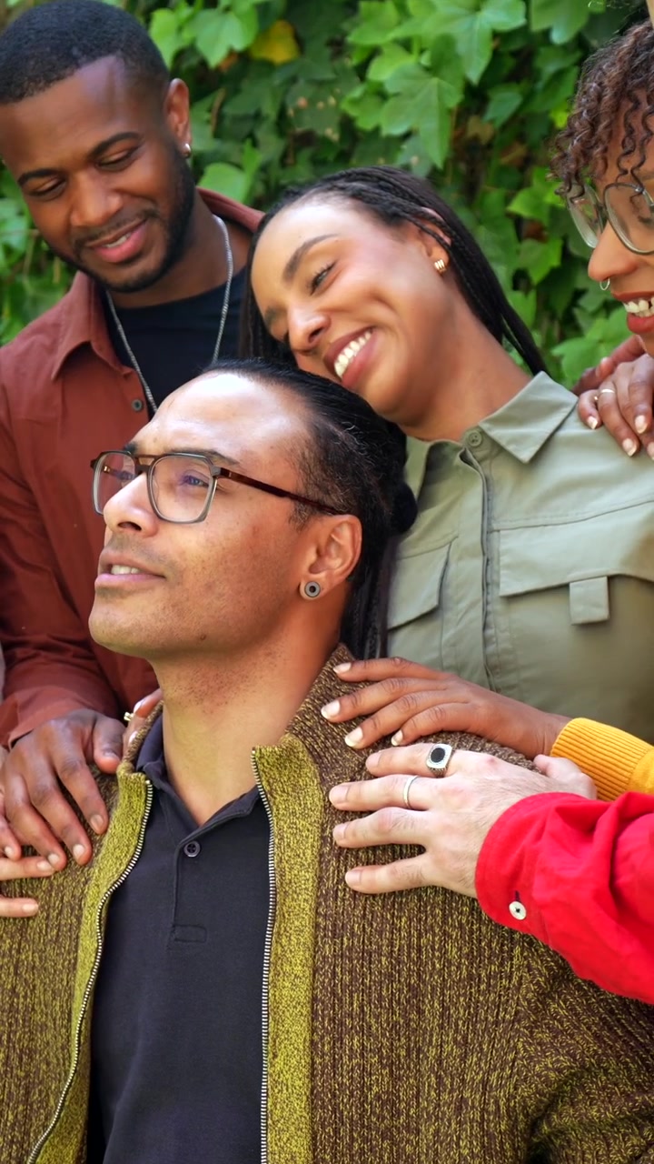 Diverse Group of Friends Supporting a Man During a Moment of Reflection