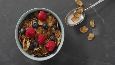 Video-of-cereals-and-fruit-in-ceramic-bowl-on-stone-kitchen-worktop