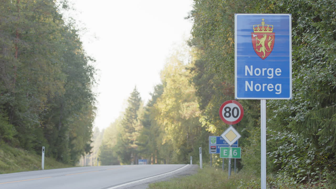 Motorcyclist Riding on a Scenic Norwegian Highway
