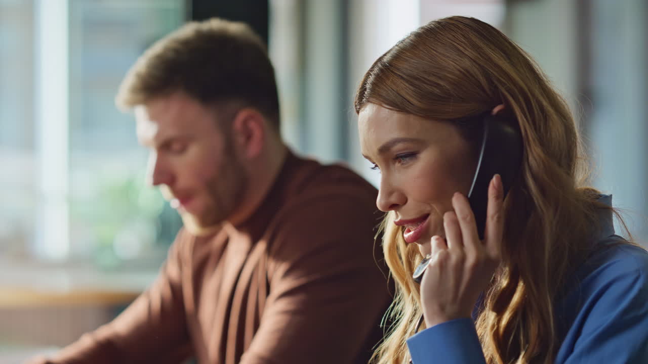 Telemarketing specialists calling telephone at office closeup. Support service