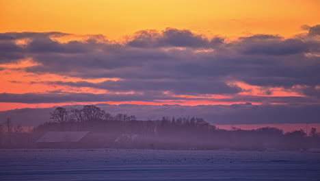 Haze-time-lapse-with-a-dramatic-sky-background-in-remote-Nordic-village-surround