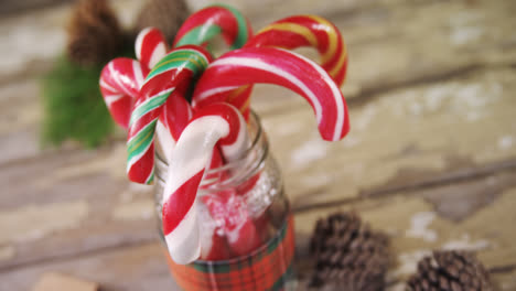 candy canes arranged in a jar 4k