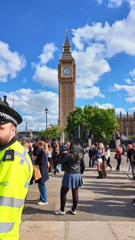 crowds of tourists visiting big ben in london