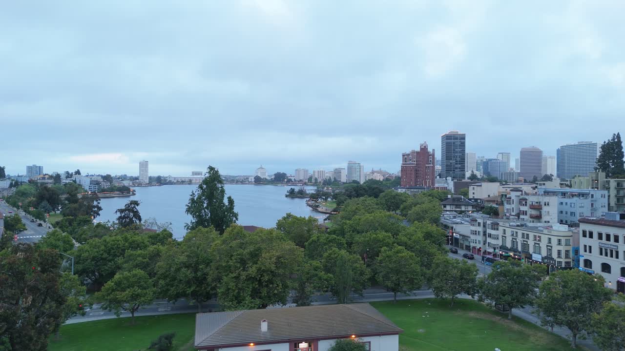 Static drone view above Lake Merritt blends natural reflections with Oakland’s diverse skyline