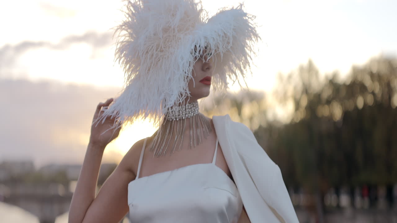 Stylish Woman in a White Feather Hat