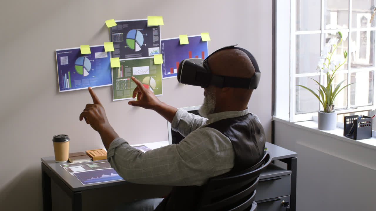 Businessman using virtual reality headset on desk 4k