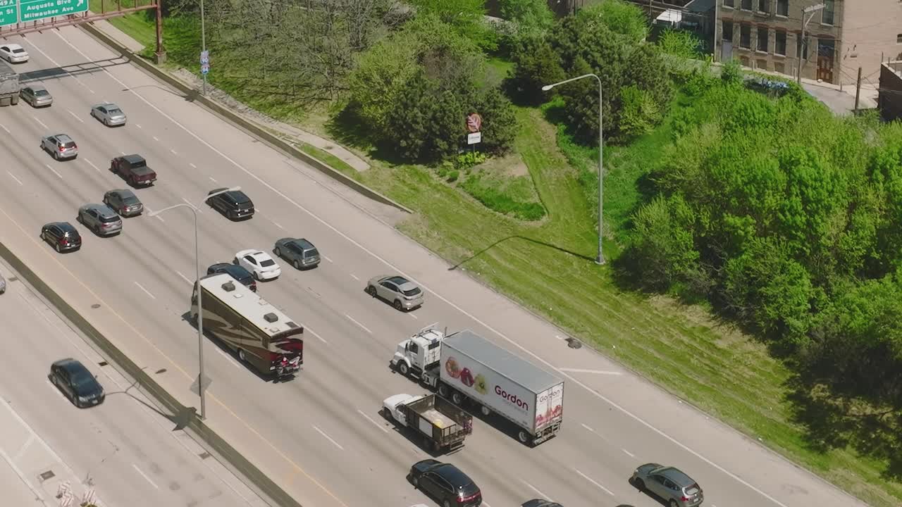Chicago traffic flows on busy expressway during daytime
