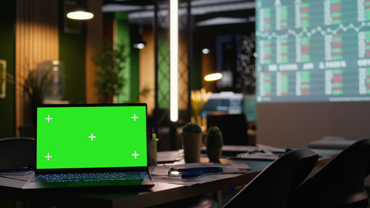 Empty boardroom with forecast indicators and a green screen