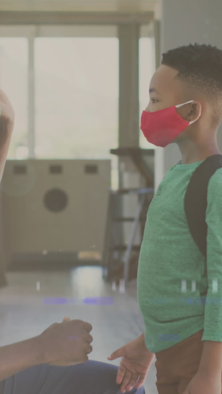 얼굴 마스크와 박수 치는 손으로 행복한 아프리카계 미국인 아버지와 아들 위에 빛의 애니메이션