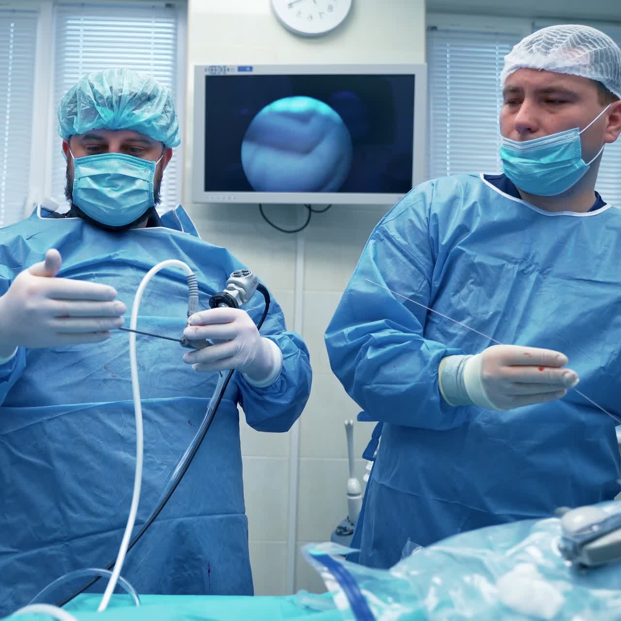 Group of doctors in operating theater. Surgeons prepare medical tools for operation in the operating room. New technologies in medicine.