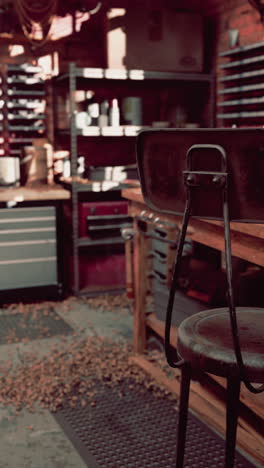 a rusty metal stool in a workshop