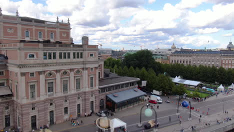 aerial rise from royal swedish opera house towards king's garden