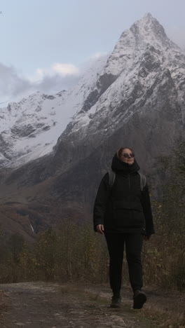 woman hiking in snowy mountains