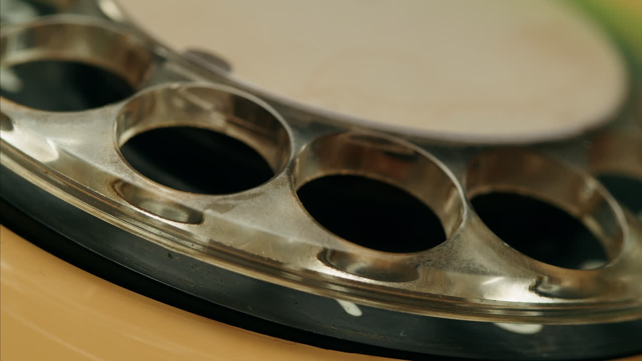 Retro vintage phone, A yellow rotary telephone is displayed on a wooden desk, adding a nostalgic touch